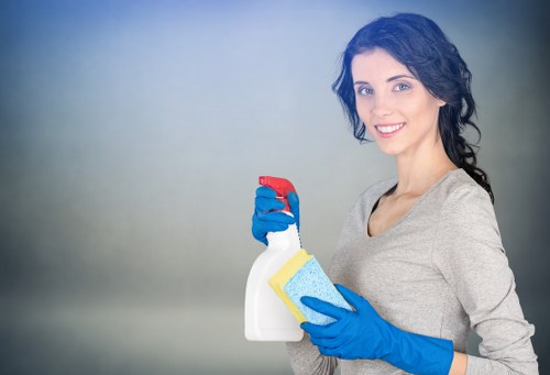 Specialist office cleaners in NW3 performing deep cleaning in an office kitchen