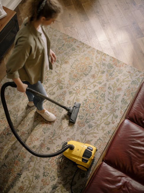 A worn floral-patterned rug with predominantly red, blue, and beige tones covers a wooden floor, displaying a slightly frayed edge. Placed on the rug is a small, white paper booklet titled 'images on 